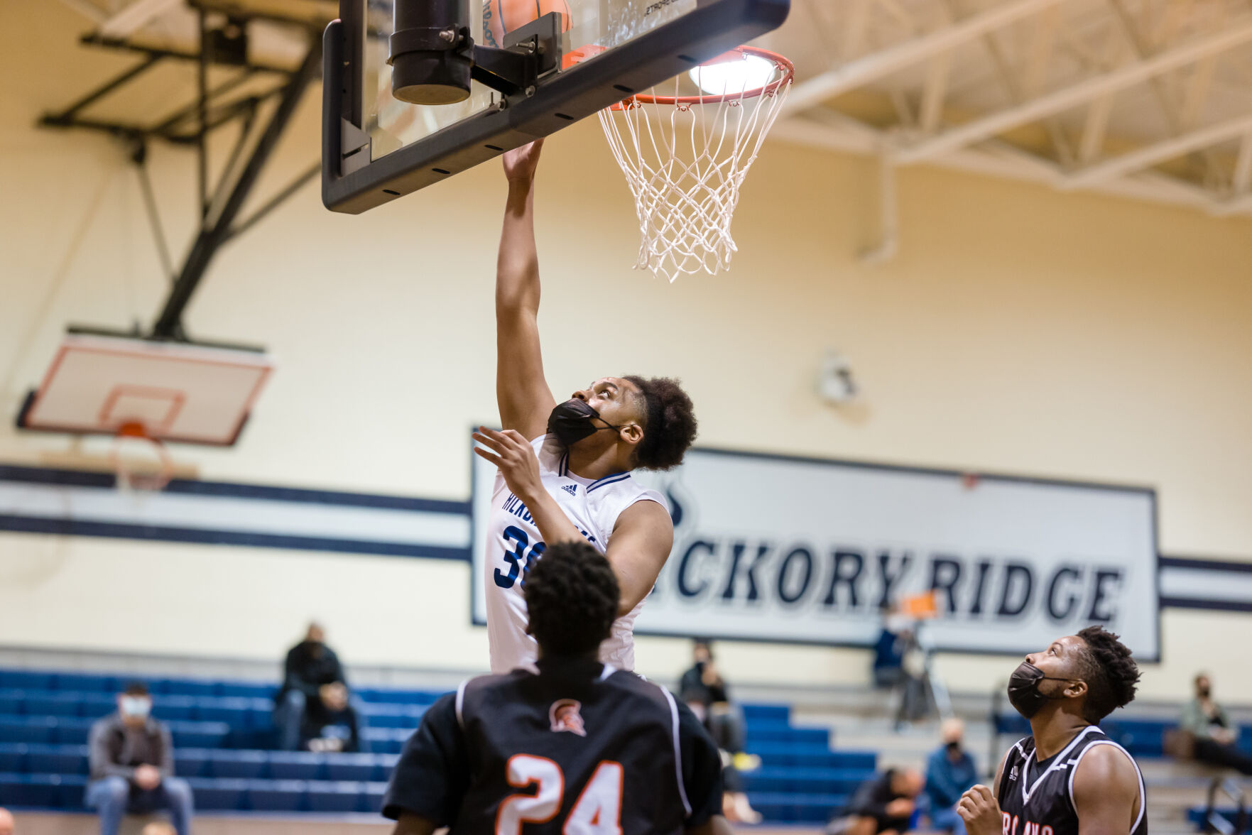 Boys Basketball: Hickory Ridge RaginÕ Bulls defeated the Northwest Cabarrus Trojans 64-56.
